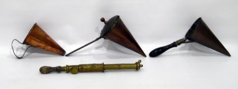 Two old copper beer moulds, another conical copper mould and an old brass spray