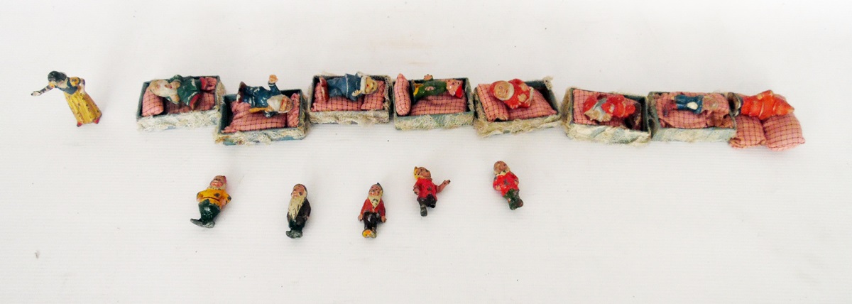 Set of lead models of Snow White and the Seven Dwarfs together with home-made match box beds and