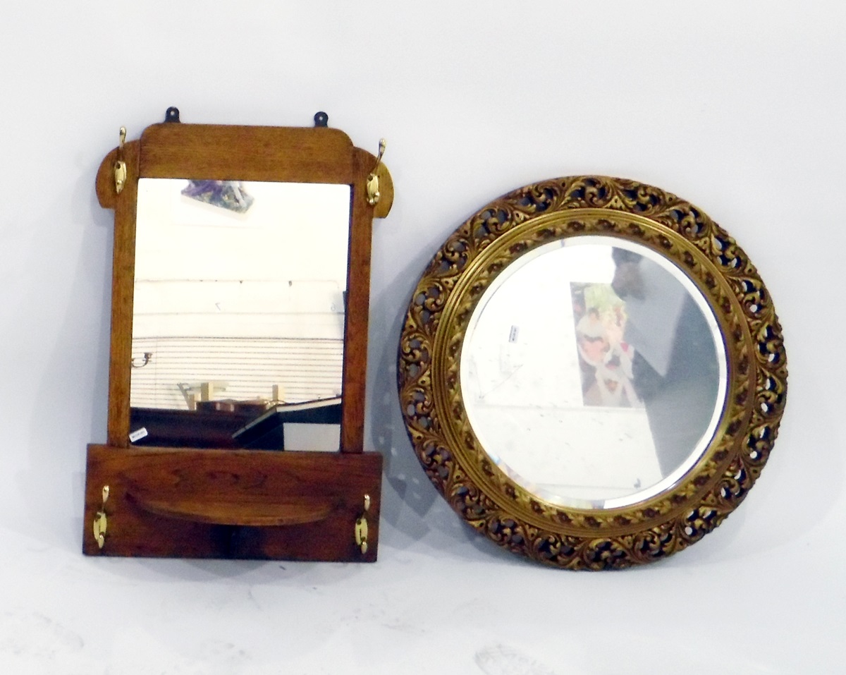 Circular bevelled plate wall mirror within a moulded ornate frame and an early 20th century vanity
