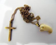 9ct gold crucifix pendant on gold-coloured metal chain and a carved bone seal pendant (2)