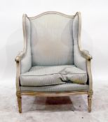 White painted wingside easy chair of Edwardian period upholstered in Regency stripe fabric