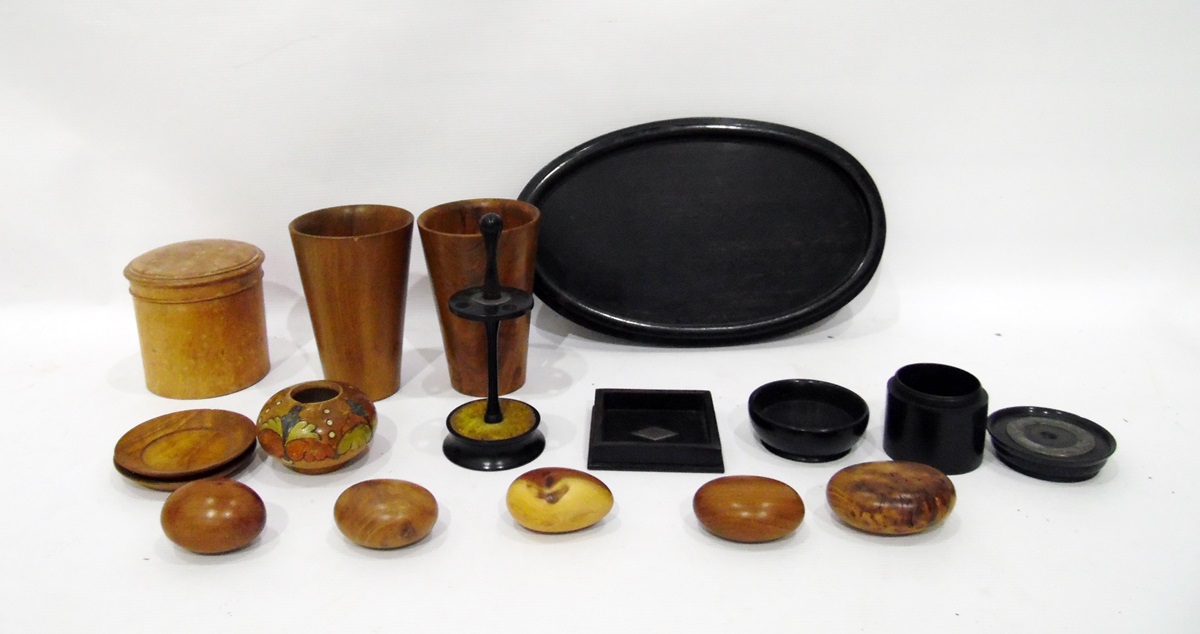 Quantity of treen to include two cups, circular box, eggs and an ebony dressing table set on an oval