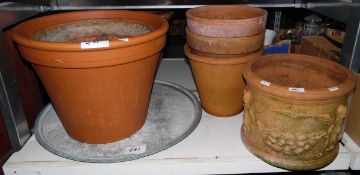 Terracotta circular garden pot, other terracotta pots and a large metal tray