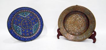 Enamelled metal plate and an Arabic copper and silver inlaid shallow dish with stand (2)