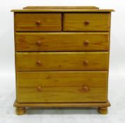 Modern varnished pine chest of two short and three graduated long drawers, each with turned knob