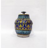 Isnik style stoneware lidded pot of pear-shaped form with overlapping lid, knop handle, decorated in