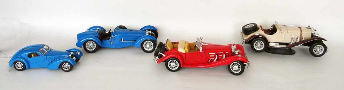 Collection of Burago scale model cars including Mercedes Benz 5500K Roadster, Bugati Atlantic,