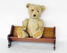 Early 20th century mohair musical bear with glass eyes, sewn nose and mouth, movable limbs, 42cm