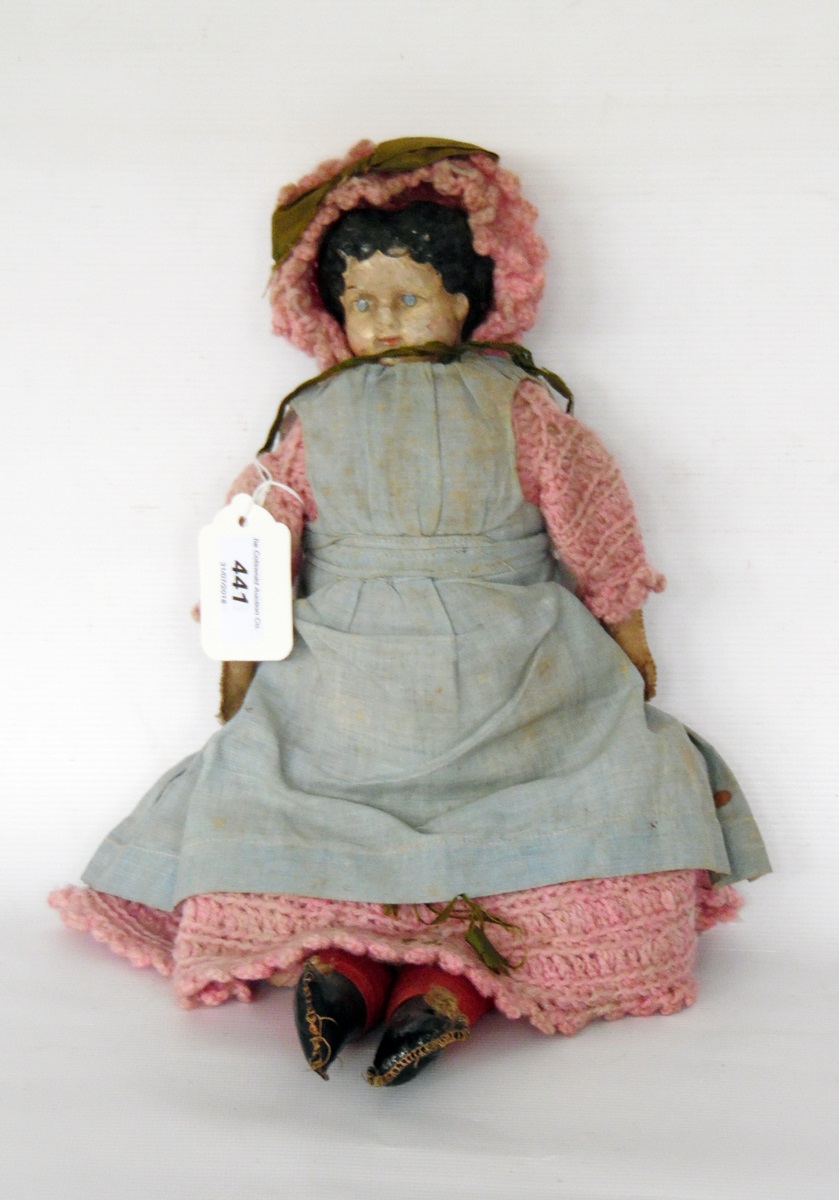 Late 19th century papier mache shoulder head doll with painted hair and features face, soft linen