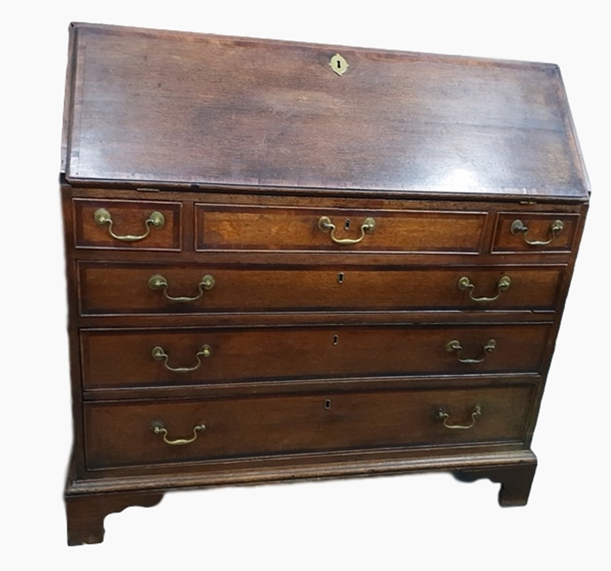 Georgian oak bureau, the fall-front enclosing a fitted interior of central cupboard, pigeonholes and