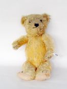 Old mohair teddy bear with glass eyes, sewn nose and mouth, 45cm long