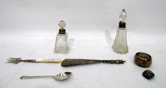 Two cut glass scent bottles with silver collars, Victorian silver and mother-of-pearl handled