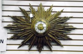 French giltwood sun-burst wall clock, having circular white painted dial and rococo gilt metal