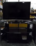 Sanyo 26" flatscreen television with remote control and black glass television stand including scart
