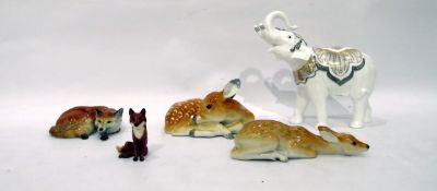 Beswick model of fox, two Russian pottery models of fawns, further fox model, 7.5cm high and a