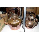 Large copper kettle, a large copper water jug, two copper hot water jugs and a tankard