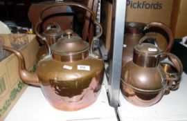 Large copper kettle, a large copper water jug, two copper hot water jugs and a tankard