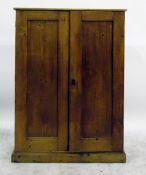 Dwarf pine two-door cupboard on plinth base, the interior fitted shelves and seven small drawers,