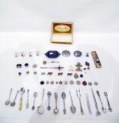 Quantity of silver plate souvenir ware to include spoons, miniature cups, etc and a box of badges,