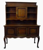 Early 20th century oak dresser, the superstructure having display shelves and central cupboard