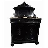 19th century continental ebonised wood side cabinet with carved arched top, shelf back, the