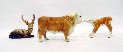 Three Beswick models to include brown horned cow, 15cm high and calf, 12cm high and a fallow deer,