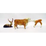 Three Beswick models to include brown horned cow, 15cm high and calf, 12cm high and a fallow deer,