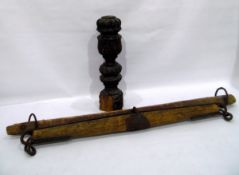 17th century foliate carved wooden pillar, a pot distressed and two iron bound cart hames (3)