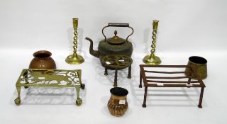 Three brass trivets, a pair of double spiral brass candlesticks, a copper kettle and three other