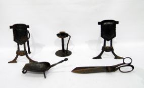 Arts & Crafts iron candlestick with dished drip tray, strapwork handle, on circular base, pair