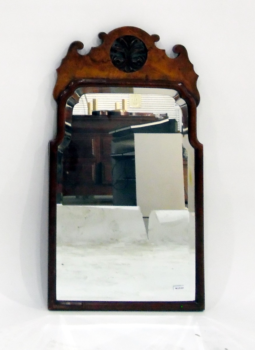 Walnut wall mirror with scroll pediment, pierced foliate design