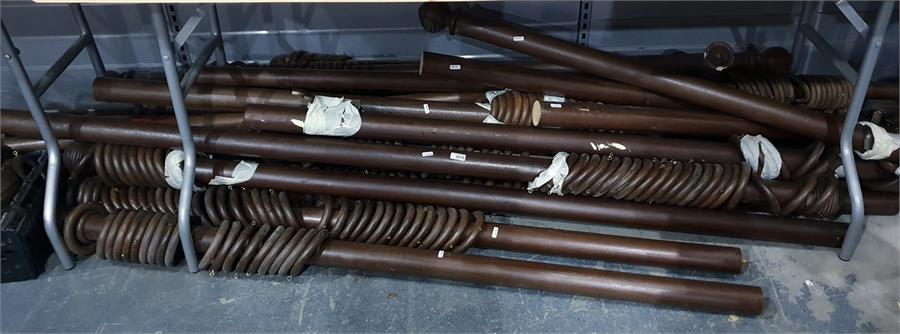 Large quantity of wooden curtain poles with rings