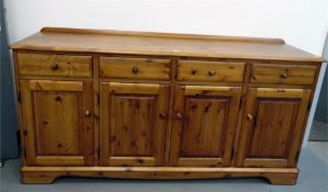 Modern stained pine cupboard with moulded edge top