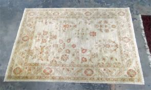 A Persian style rug, cream ground with orange border, floral decorated, 101 cm x 148 cm
