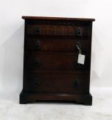 Oak reproduction chest of four drawers with metal