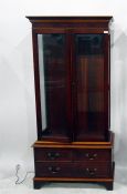 Modern mahogany display cabinet enclosed by two be