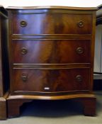 Reproduction mahogany serpentine front chest of th