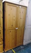 Modern pine wardrobe, the pair of fielded panel do