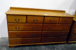 Modern pine chest of ten drawers, raised on bracke