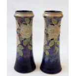 Pair of Royal Doulton tube-lined vases decorated w