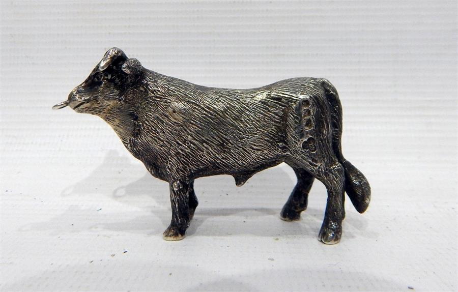 A silver model bull, date marks worn, makers SMD (