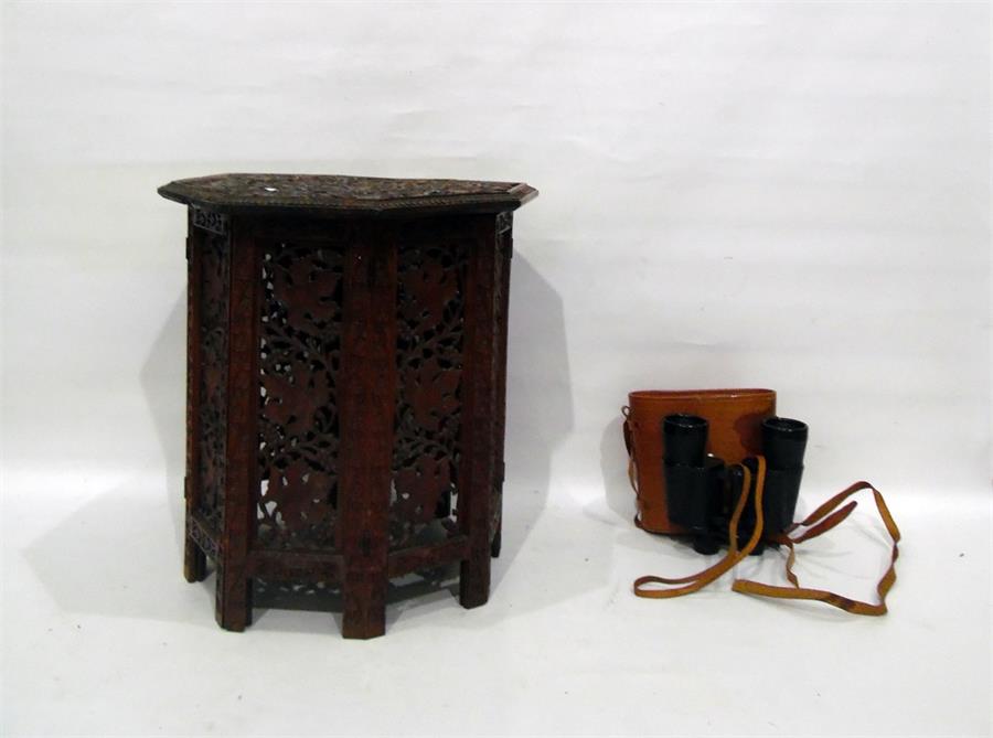 Pierced carved octagonal table and a pair of leath