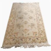 A modern silk Oriental style rug, cream ground, floral
