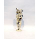 Japanese carved ivory figure of man carrying child