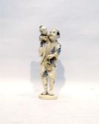 Japanese carved ivory figure of man carrying child