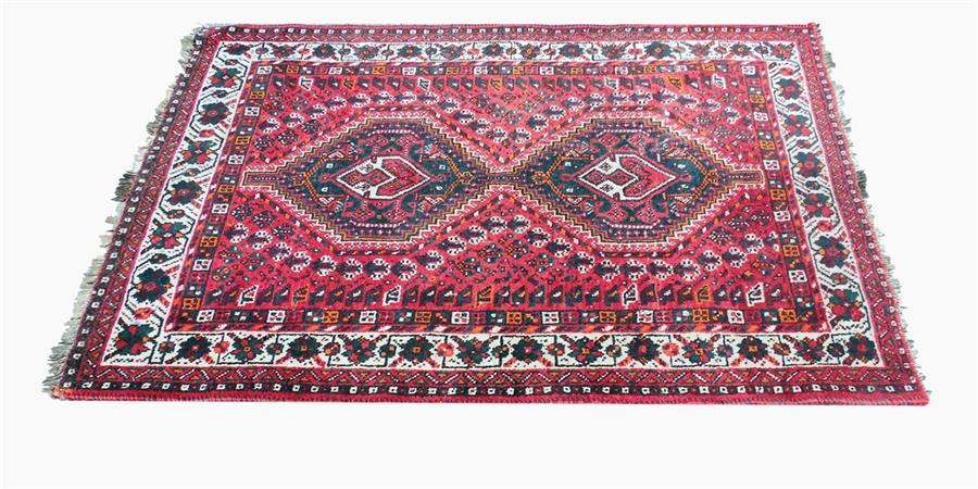 Persian wool rug, red ground with black, orange and beige borders