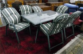 Glass topped patio table and a set of six tubular