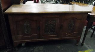 Early 20th century oak sideboard, the carved centr