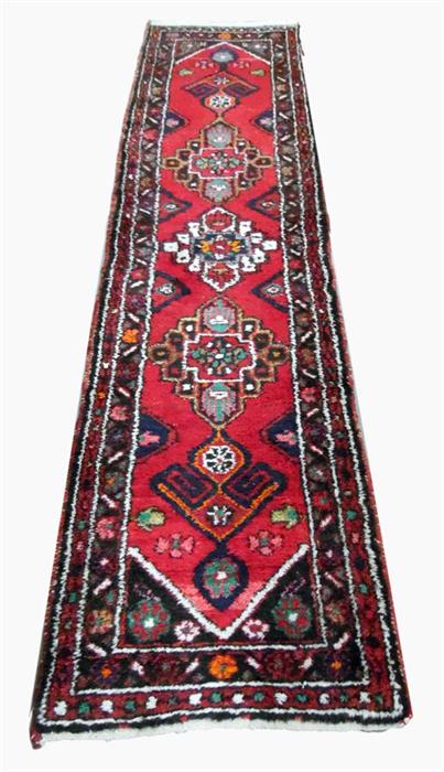 Persian wool runner, red ground with black, white and green borders, 265 cm x 65 cm