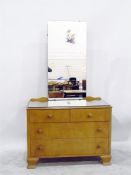 Modern dressing chest with pivoted mirror back, a